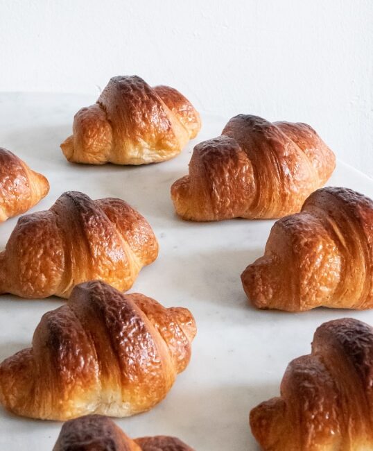 A close up of some croissants on a counter